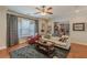 Open-concept living room with wood floors and natural light is perfect for entertaining and relaxing at 3452 Village Park Sw Ln, Atlanta, GA 30331