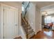 Staircase with hardwood floors is near a coat closet at 3452 Village Park Sw Ln, Atlanta, GA 30331