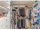 Walk-in closet featuring custom shelving and ample storage, making organization easy and accessible at 3452 Village Park Sw Ln, Atlanta, GA 30331