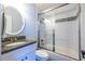 Bathroom features a granite countertop vanity, tile shower, and glass doors at 1346 Stillwood Chase Ne, Atlanta, GA 30306