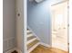 Entryway with stairs leading to a half-bathroom, complete with modern fixtures and design at 1346 Stillwood Chase Ne, Atlanta, GA 30306