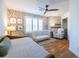Bedroom with a daybed, crib, accent wall, and a ceiling fan at 1346 Stillwood Chase Ne, Atlanta, GA 30306