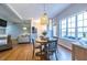 Open-concept dining area adjacent to the living room and kitchen, featuring hardwood floors at 1346 Stillwood Chase Ne, Atlanta, GA 30306