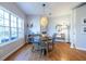 Cozy dining area featuring hardwood floors and natural light from a large window at 1346 Stillwood Chase Ne, Atlanta, GA 30306