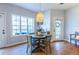 Bright dining area with hardwood floors, stylish lighting, and views of the outdoors at 1346 Stillwood Chase Ne, Atlanta, GA 30306