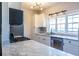 Well-lit kitchen with marble countertops, stainless steel appliances, and sleek white cabinetry at 1346 Stillwood Chase Ne, Atlanta, GA 30306