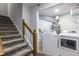 Laundry Room with full size washer and dryer hookups and adjacent staircase at 1346 Stillwood Chase Ne, Atlanta, GA 30306