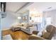 Inviting living room features hardwood floors, a comfortable sectional, and access to the kitchen at 1346 Stillwood Chase Ne, Atlanta, GA 30306