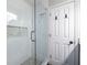 Shower with glass door, white subway tiles, and a built-in niche at 1346 Stillwood Chase Ne, Atlanta, GA 30306