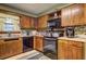 A functional kitchen featuring classic wood cabinetry and modern appliances at 3341 Rae Pl, Lawrenceville, GA 30044