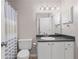 Well-lit bathroom with a vanity, toilet, and shower with a stylish curtain at 3655 Habersham Ne Rd # 215, Atlanta, GA 30305