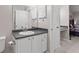 Clean bathroom with a toilet, vanity, and access to a hallway at 3655 Habersham Ne Rd # 215, Atlanta, GA 30305