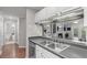 Spacious kitchen with a breakfast bar, stainless steel sink, and view of the living spaces at 3655 Habersham Ne Rd # 215, Atlanta, GA 30305