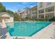 Sparkling community pool surrounded by lounge chairs and lush landscaping, a perfect place to relax at 3655 Habersham Ne Rd # 215, Atlanta, GA 30305