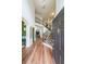Bright foyer with hardwood floors, a staircase, and views into other living spaces at 4118 Kentmere Main Nw, Kennesaw, GA 30144