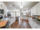 Updated kitchen with stainless steel appliances, granite countertops, and breakfast bar seating at 4118 Kentmere Main Nw, Kennesaw, GA 30144