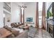 Spacious living room with soaring ceilings, fireplace, and abundant natural light at 4118 Kentmere Main Nw, Kennesaw, GA 30144