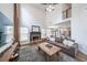 Cozy living room with a fireplace, and views into the kitchen at 4118 Kentmere Main Nw, Kennesaw, GA 30144