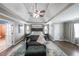 Spacious main bedroom with tray ceiling, sitting area, and connecting bathroom at 4118 Kentmere Main Nw, Kennesaw, GA 30144