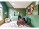 Bright office with large window, an accent rug, and views of the front yard at 4118 Kentmere Main Nw, Kennesaw, GA 30144
