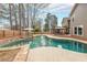 Beautiful backyard pool and outdoor living space with a jacuzzi, gazebo, and stone accents at 4118 Kentmere Main Nw, Kennesaw, GA 30144