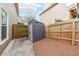 Practical backyard shed alongside a well-maintained fence, offering outdoor storage and security at 4118 Kentmere Main Nw, Kennesaw, GA 30144