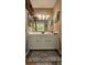 Bathroom featuring vanity and large mirror at 47 Monet Nw Ct, Atlanta, GA 30327
