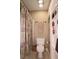 Cozy bathroom with tiled floors, shower and storage shelves at 47 Monet Nw Ct, Atlanta, GA 30327