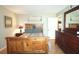 Cozy bedroom featuring wooden furniture, hardwood floors and natural light at 47 Monet Nw Ct, Atlanta, GA 30327