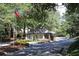 Inviting entrance to a gated community, with lush landscaping and manicured grounds at 47 Monet Nw Ct, Atlanta, GA 30327