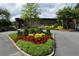 Beautiful entrance to a community area, with vibrant flowers and well-maintained landscaping at 47 Monet Nw Ct, Atlanta, GA 30327