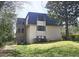 Exterior view of complex building, greenery and grass at 47 Monet Nw Ct, Atlanta, GA 30327