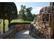 Stone wall with directional sign to the pro shop, management office, and fitness center at 47 Monet Nw Ct, Atlanta, GA 30327