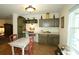 This eat-in kitchen area offers custom cabinets, and lots of natural light at 47 Monet Nw Ct, Atlanta, GA 30327