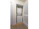 Functional laundry closet featuring stacked washer and dryer at 47 Monet Nw Ct, Atlanta, GA 30327