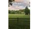 Beautiful pond with lush greenery and a wooden fence, offering a picturesque view at 47 Monet Nw Ct, Atlanta, GA 30327
