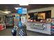 Golf pro shop with golf clubs, golf balls, snacks, drinks, apparel, and service counter at 47 Monet Nw Ct, Atlanta, GA 30327