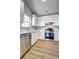 Well-lit kitchen with modern appliances, white cabinets, and ample counter space at 6776 Gina Agha Cir, Lithonia, GA 30038