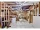 Unfinished basement with exposed wood framing, concrete floor, and utilities visible at 1450 Pinyon Pl, Lawrenceville, GA 30043