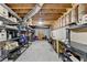 Spacious basement with exposed beams and metal shelving providing ample storage space for an organized home at 1450 Pinyon Pl, Lawrenceville, GA 30043