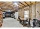 Unfinished basement space with exposed insulation, a table, and ample room for storage at 1450 Pinyon Pl, Lawrenceville, GA 30043