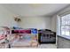 Bedroom with a bunk bed, crib, dresser, and a window with natural light at 1450 Pinyon Pl, Lawrenceville, GA 30043