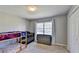A bedroom with a bunk bed, crib, dresser, and carpeted floor at 1450 Pinyon Pl, Lawrenceville, GA 30043