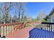 Spacious deck overlooking large backyard, surrounded by verdant trees, offering a serene outdoor space at 1450 Pinyon Pl, Lawrenceville, GA 30043