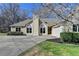 Charming home with a well-manicured lawn, blooming tree, and inviting curb appeal, perfect for Gathering living at 1450 Pinyon Pl, Lawrenceville, GA 30043