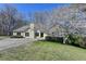 Charming single-story home with a well-manicured front yard and inviting curb appeal at 1450 Pinyon Pl, Lawrenceville, GA 30043