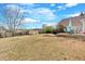 Spacious backyard featuring a patio, shed, and expansive lawn, perfect for outdoor activities at 251 Bent Creek Dr, Dallas, GA 30157