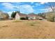 Spacious backyard featuring a well-maintained lawn and a patio seating area, great for outdoor activities and relaxation at 251 Bent Creek Dr, Dallas, GA 30157