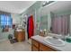 Bathroom featuring a double vanity, tile floors, and a mirror to brighten the room, creating a comfortable space at 251 Bent Creek Dr, Dallas, GA 30157