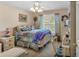 Bright bedroom with a comfortable bed, a window with curtains, and a ceiling fan to circulate air at 251 Bent Creek Dr, Dallas, GA 30157